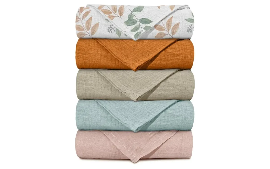Professional-grade 100% cotton muslin. Primarily solid-colored with delicate botanical vine motifs. Highly absorbent and breathable for infant skin protection. OEM/ODM custom-ready; guaranteed capable of passing OEKO-TEX/GOTS.