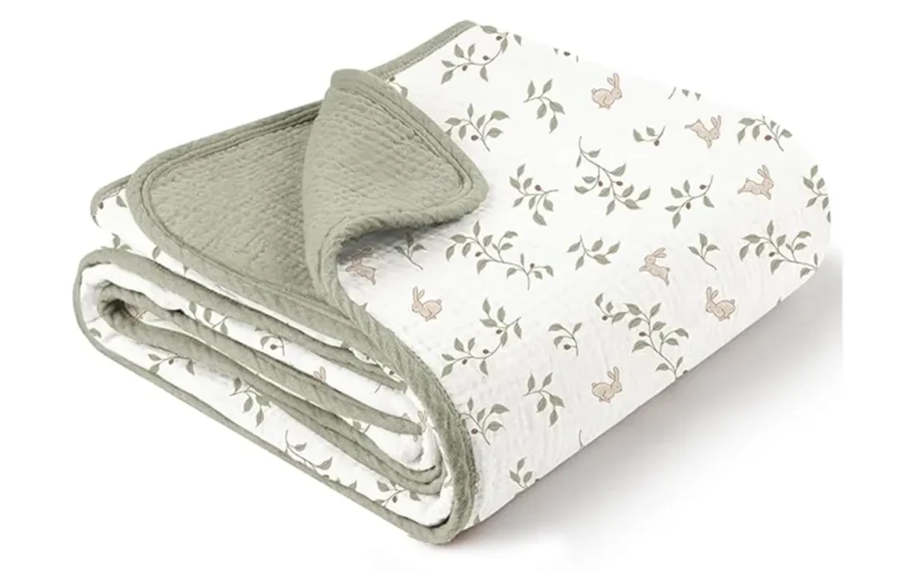 Sage Green muslin with bunny and botanical vine patterns. Breathable, soft, and skin-protecting. 2026 OEKO-TEX/GOTS compliance capability. Fully integrated OEM/ODM manufacturing.