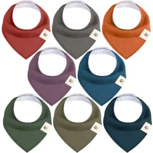 Featured bibs include Brick Red, Dark Gray, Copper, Dusty Mauve, Deep Petrol, Olive Green, Khaki Brown, and Midnight Blue, featuring the Inorange brand label. These highly absorbent purely handcrafted 100% cotton bibs prioritize moisture-wicking softness. Professional OEM, ODM, and Customized services are guaranteed to pass GOTS and OEKO-TEX.