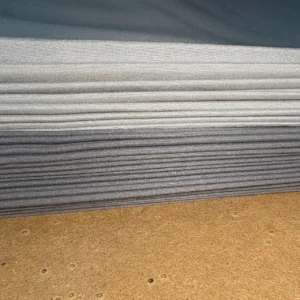 Organized fabric layering preparation showcasing multiple premium muslin layers ready for production. Strategic material stacking ensures efficient cutting precision. Professional OEM/ODM manufacturing from Chinese B2B baby textile factory.