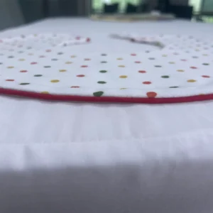 Precise Stitching and Finishing Process features specialized edge piping and binding application on baby bibs blanks. Professional outer binding technique creates reinforced, soft edges. OEM/ODM manufacturing from professional Chinese B2B baby textile factory.