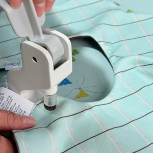 Snap Fastening Process completion reveals professional snap installation quality through close-up verification. Perfect snap alignment and secure fastening demonstrate manufacturing excellence. OEM/ODM manufacturing from professional Chinese B2B baby textile factory.