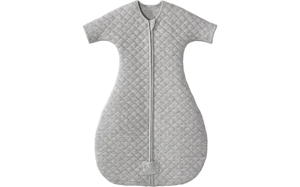 Heather grey diamond-quilted baby sleep sack features an ergonomic transition shape with short sleeves and a hip-healthy bell-shaped bottom. Purely handcrafted from 100% cotton, it ensures high absorbency, breathable softness, and total skin protection. Global B2B partners receive expert OEM, ODM, and Customized support, with all units guaranteed to pass GOTS and OEKO-TEX safety benchmarks.