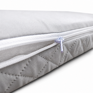 The outer mattress shell features an advanced ultrasonic quilted diamond embossed pattern on durable grey fabric. This threadless construction maximizes breathability and hypoallergenic safety.