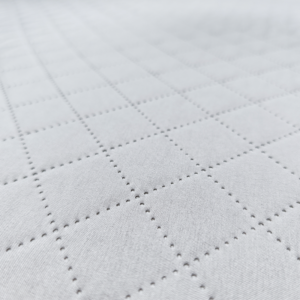 The removable cover on our infant mattress features a smooth-glide, concealed zipper track for optimal sanitation. Our factory provides certified safe textiles built for commercial laundering cycles.