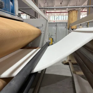 Our industrial manufacturing setup utilizes high-capacity carding machinery to systematically organize raw, low-melting-point fibers into a uniform, continuous web layout. This foundational cross-lapping step carefully builds up consistent material depth and density, providing a clean, non-woven structure perfectly prepped for subsequent thermal processing.
