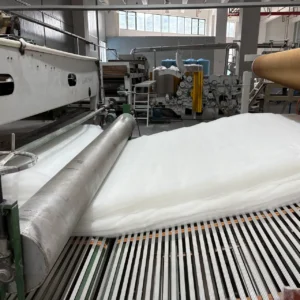Our automated conveyor system stacks multiple lightweight fiber web layers to carefully achieve the precise thickness needed for optimal infant orthopedic support. This uniform structural accumulation guarantees that the multi-layered material bed remains structurally sound before moving beneath our heavy-duty compression rollers.