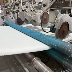 At the end of the mattress core production line, our multi-blade precision cutting system executes highly accurate longitudinal cuts. Moving away from traditional, simple manual trim methods, this robust mechanical limit design features synchronized multi-blade units to slice through the solid fiber panel, ensuring size precision within industry-leading tolerances.