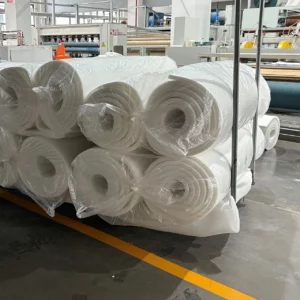 Our final handling workflow processes the verified, precision-cut mattress cores into compressed, rolled configurations wrapped securely in protective clear film. This heavy-duty roll-packing technique maintains pristine, dust-free cleanliness while significantly optimizing container space and lowering international shipping costs.