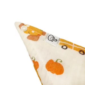 Brand label detail showcasing professional craftsmanship and premium snap placement. Harvest Joy design demonstrates vibrant color quality. Professional Chinese baby textile factory providing complete OEM/ODM customization services.
