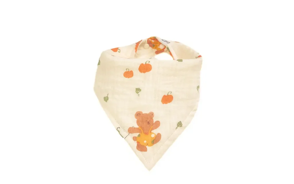 Premium 100% cotton muslin baby bibs featuring vibrant Harvest Joy autumn theme with pumpkins, bears, and trucks. Multi-wash processed for exceptional softness. OEM/ODM customization available for bibs for baby brands globally.