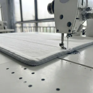 Our industrial sewing setup utilizes flat-seaming techniques to precisely join smooth velvet with premium cotton fabric layers. As an expert baby textile factory in China, we manage edge-alignment meticulously to ensure that every double-sided blanket achieves a perfectly flush, puckering-free boundary.