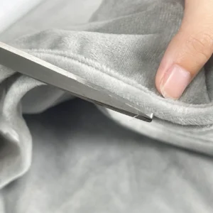 Our final review process involves meticulous manual trimming to completely eliminate any remaining thread ends or loose fibers. Operating as a detail-oriented baby textile factory in China, we execute this comprehensive surface cleaning phase to ensure a flawless tactile presentation that is perfectly safe for an infant's skin.