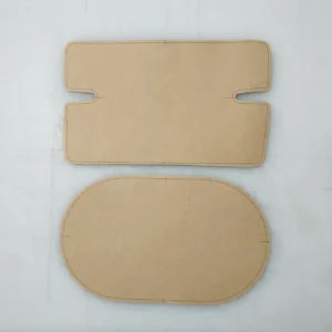 Our high-chair seat cushion manufacturing process demonstrates the precision cutting stage, combining pre-made pattern cardboard templates with professional chalk tracking on premium quilted fabric. As a specialized baby textile factory in China, we apply these rigorous manual production techniques to ensure flawless dimensional consistency for every fabric component.
