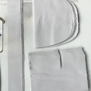 Our precisely cut high-chair cushion fabric panels are stacked neatly following the automated and manual panel-shaping production phase. Operating as an advanced baby textile factory in China, we maintain strict dimensional tolerances on all custom-shaped panels to ensure subsequent assembly alignment is perfectly flawless.