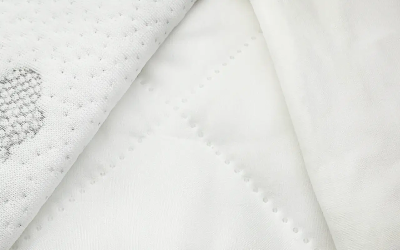 Infant mattress cover fabric three-option display showcases left jacquard fabric, middle ultrasonic quilted fabric, right TC fabric. Three fabrics each with distinctive features meeting diverse consumer needs. We provide professional OEM customization supporting fabric selection, technique design, and color customization comprehensive customization services.