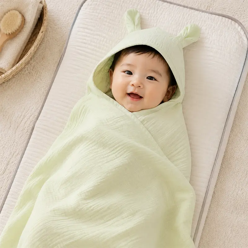 Baby wrapped in muslin cloth display showing soft comfortable warmth. Muslin breathability excellent. We provide OEM customization supporting wrap product specifications, design style, and safety standard multi-dimensional customization services.