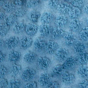 Our advanced jacquard textile technology creates stable, three-dimensional textured loop patterns directly on the soft breathable cotton base. Operating as a specialized baby textile factory in China, we ensure all textured weaves maintain exceptional structural integrity through repetitive laundering.