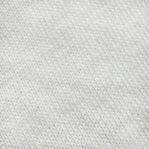 Our 100% cotton knit fabric close-up highlights the meticulous interlocked loop structure that guarantees maximum elasticity and natural breathability. As a compliance-focused baby textile factory in China, we strictly control yarn quality to eliminate surface imperfections.