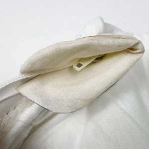 Our finished closure assembly incorporates a soft, custom-molded protective fabric tab at the top terminal to wrap around the metal zipper slider securely. As a safety-focused baby textile factory in China, we prioritize these integrated guard flaps to protect an infant's delicate skin from scratches.