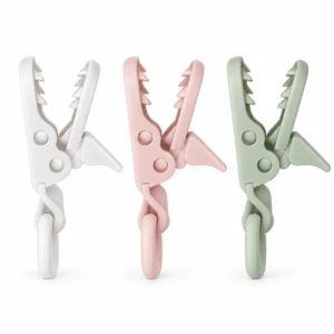 Our PU plastic pacifier clips show three soft colors, gripping teeth, pivot joints and silicone loops, presenting our fastening structure for custom silicone clip ranges. Inorange Baby offers OEM/ODM.